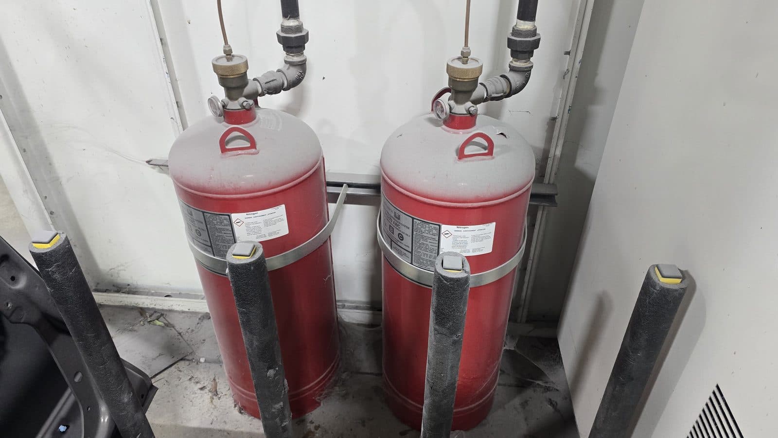 Paired industrial fire suppression cylinders with nitrogen actuation