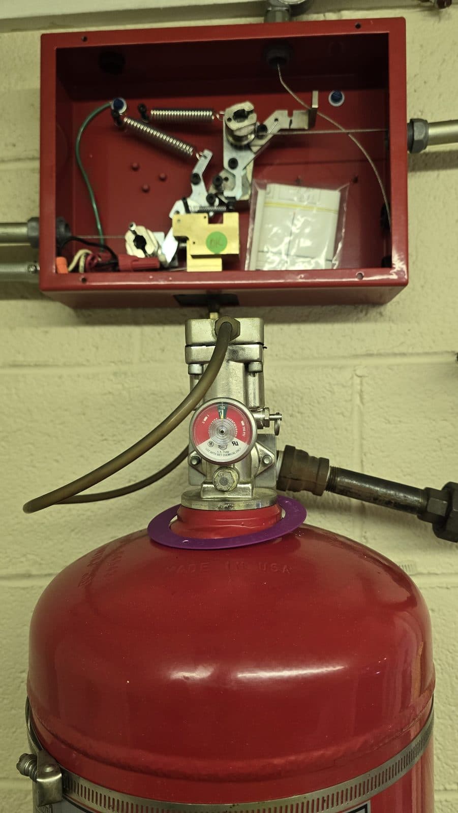 Wet chemical suppression cylinder with mechanical control head and pull station